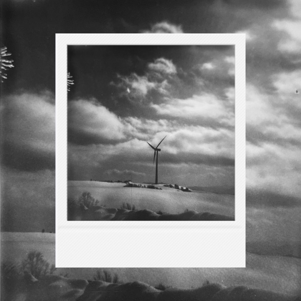 A black and white image record condensing a sense of time within quiet landscapes shaped by cloud density and drifting light