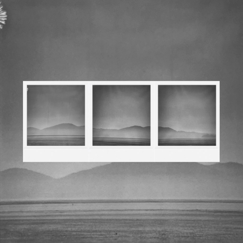 The silhouette of mountain ranges fading into deep mist capturing a record of faint contemplation within coarse monochrome film grains